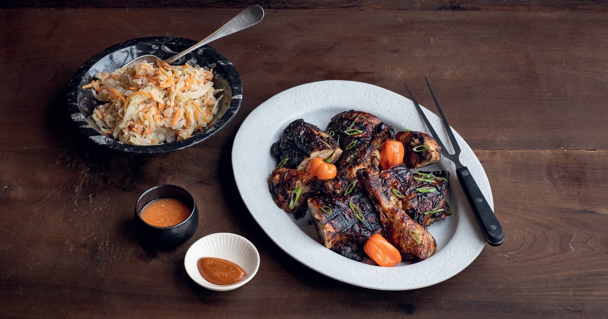 Kwame Onwuachi Serves Spicy Jerk Chicken With Braised Cabbage and Carrots