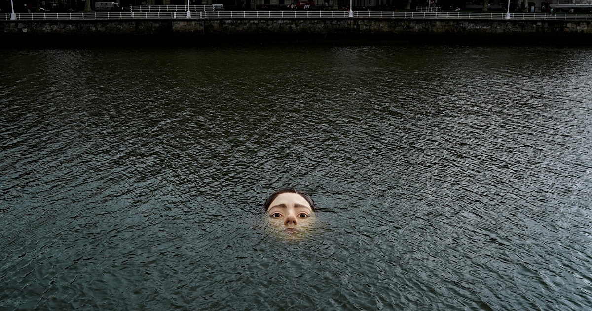 Drowning girl statue submerged in river causes a stir