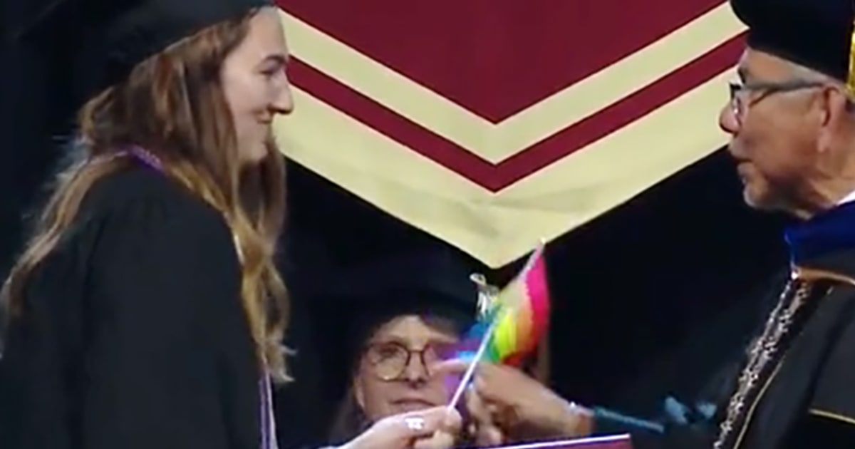 Seattle Pacific University Graduates Hand President Pride Flags in