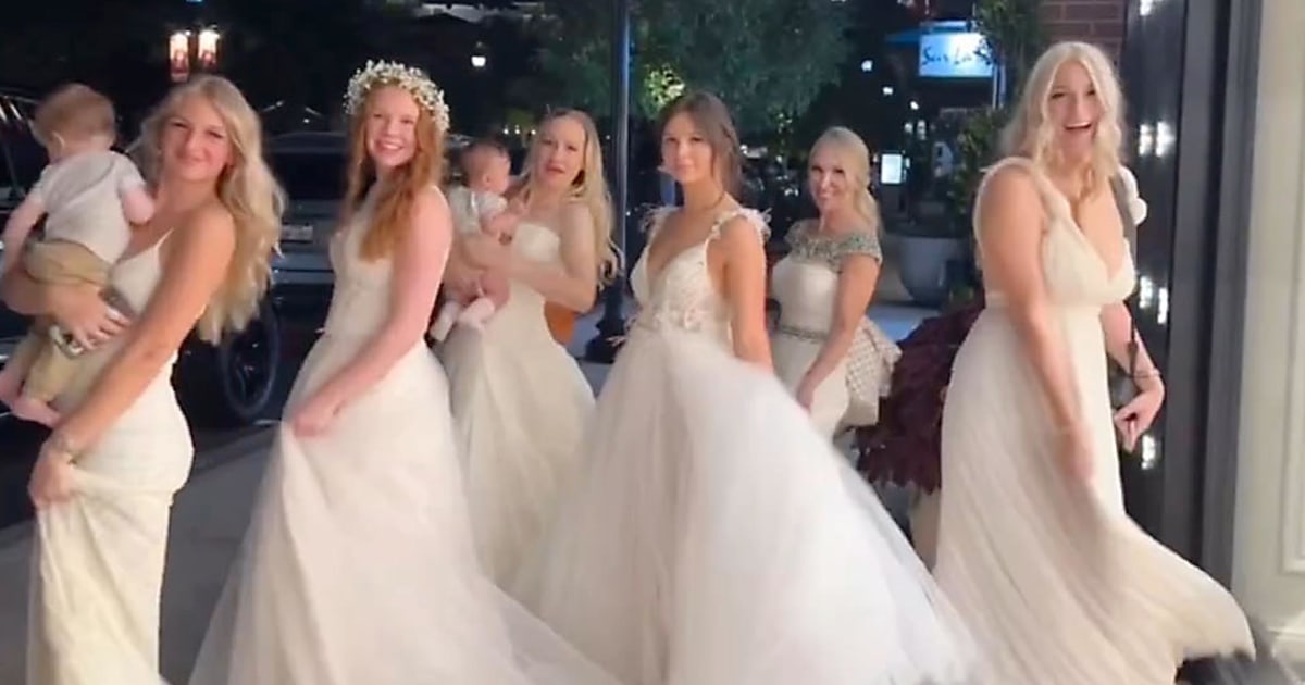 Mom and daughters go viral for wearing wedding dresses to dinner 'A(01)