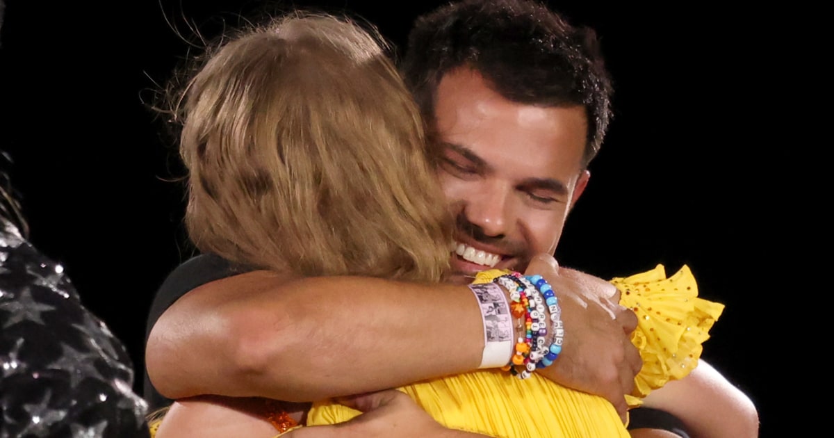 Taylor Lautner backflips onto the stage for special appearance at