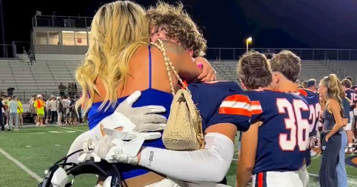 #Mom’s Straddling Hug With Teen Son At Football Game Goes Viral