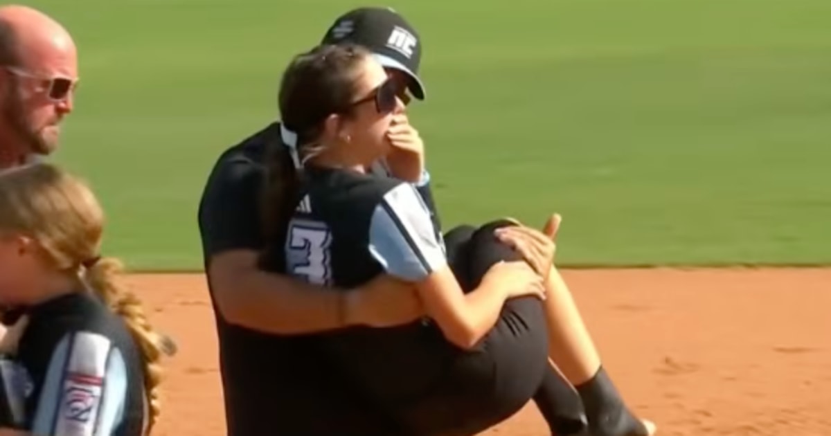 Father Who Went Viral for Carrying Injured Daughter to Celebrate Softball World Series Win Calls It ‘Dad Instincts’